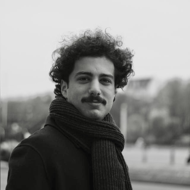 Black-and-white portrait of Ata Murat Kalkan